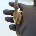 rolex-daytona-yellow-gold-champagneblack-index-dial-ceramic-bezel-oysterflex-rubber-bracelet-116518ln-replica-klmup.webp