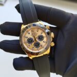 rolex-daytona-yellow-gold-champagneblack-index-dial-ceramic-bezel-oysterflex-rubber-bracelet-116518ln-replica-klmup.webp